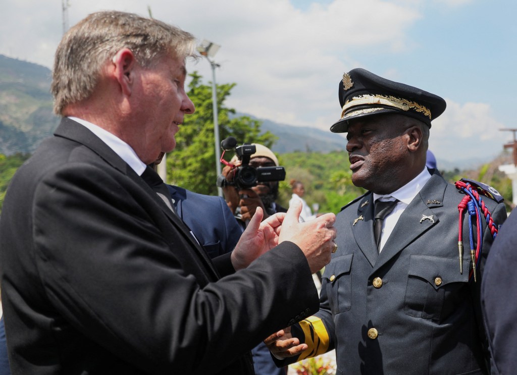 U.S. ambassador to Haiti, Dennis Hankins talks with Police Chief Frantz Elbe after Haitiâs transitional council ceremony, on the outskirts of Port-au-Prince, Haiti April 25, 2024.