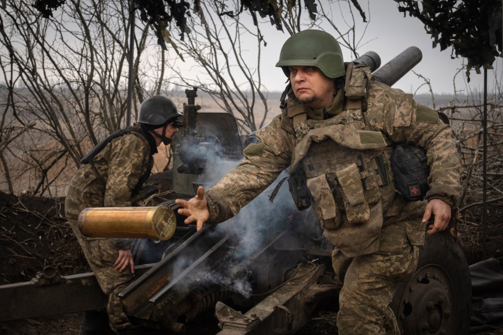 Ukrainian soldiers with the 71st Jaeger Brigade fire a M101 howitzer at Russian positions on the front line, near the city of Avdiivka in Ukraine's Donetsk region, on March 22, 2024.