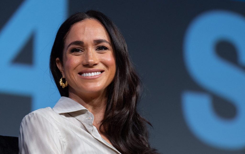 Meghan Markle, Duchess of Sussex, smiling at the camera during the 'Keynote: Breaking Barriers, Shaping Narratives' at SXSW 2024 Conference in Austin, Texas