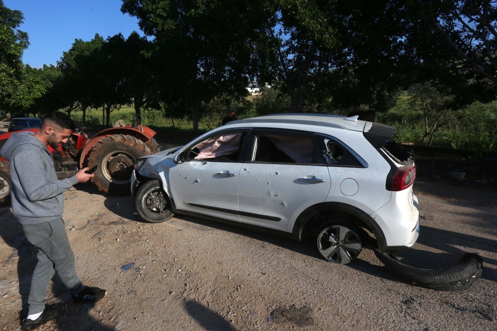 The Israeli Defense Forces said a number of weapons and military-style equipment, including automatic rifles, were found inside the vehicle.