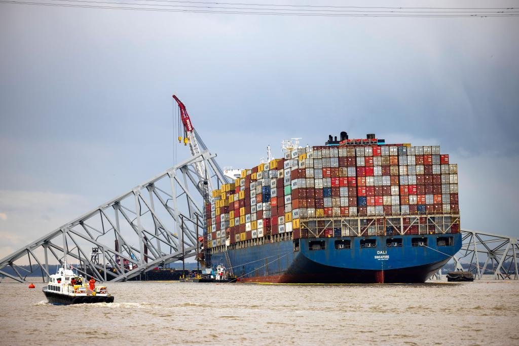Steel beams from the collapsed Francis Scott Key Bridge lie across the 984-foot cargo ship Dali in Baltimore, Maryland, USA, 04 April 2024.