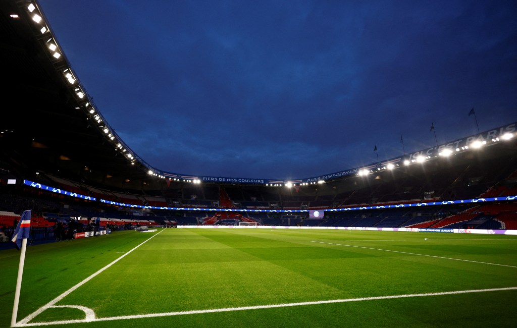 General view of the Parc des Princes stadium in Paris before the Champions League match between Paris St Germain and Real Sociedad on February 14, 2024, with football field lights shining under a blue sky