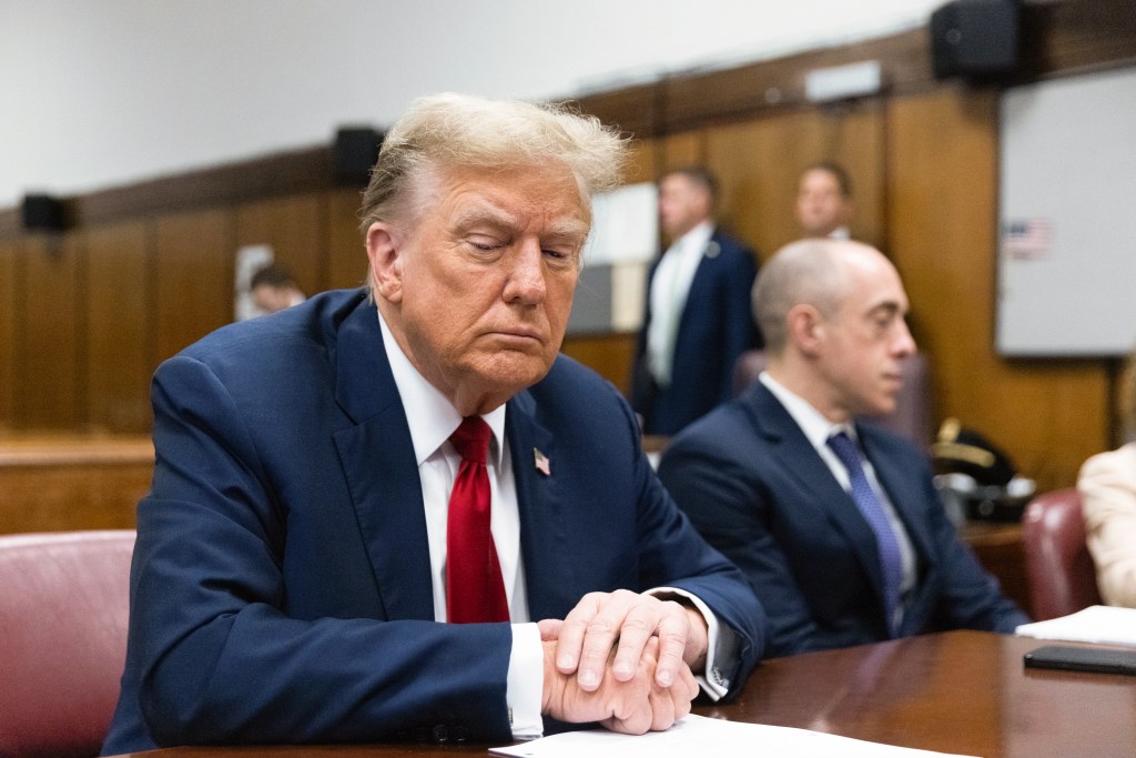 Former U.S. President Donald Trump seated in a Manhattan criminal court for his hush money trial in April 2024