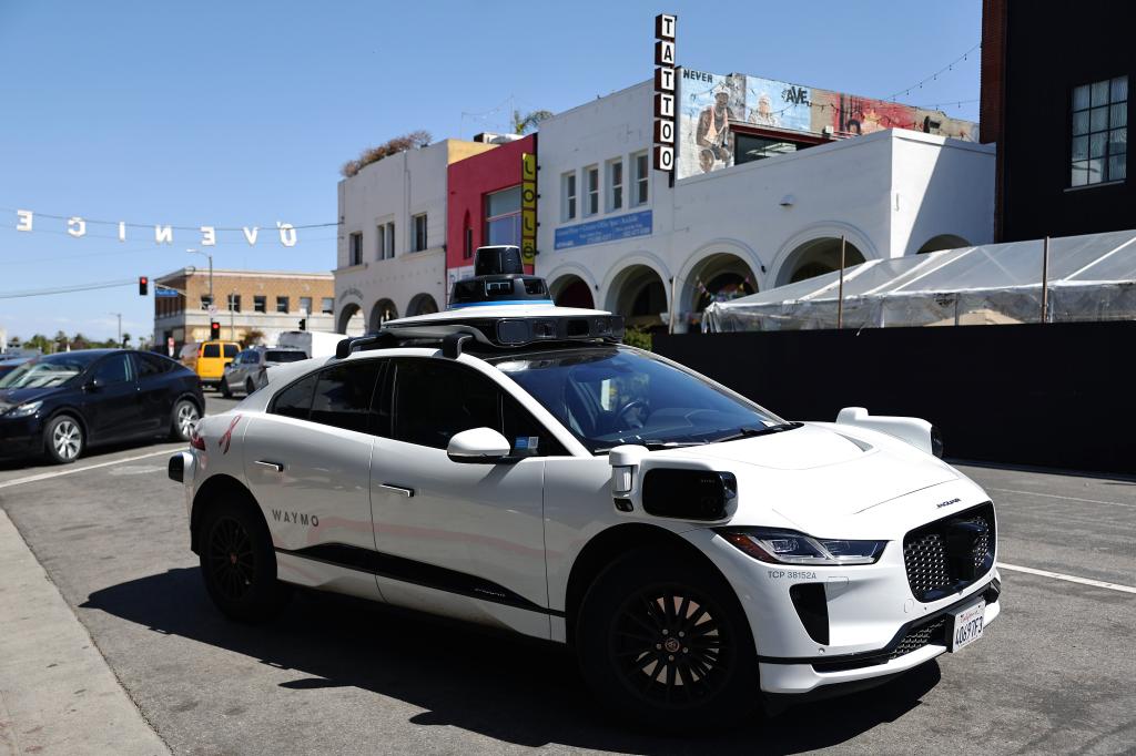 Waymo autonomous self-driving Jaguar taxi driving near Venice Beach, Los Angeles