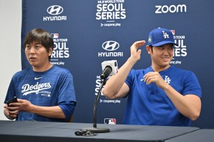 Los Angeles Dodgers' Shohei Ohtani (R) and his interpreter Ippei Mizuhara (L) attending a press conference at Gocheok Sky Dome in Seoul ahead of the 2024 MLB Seoul Series baseball game between Los Angeles Dodgers and San Diego Padres.