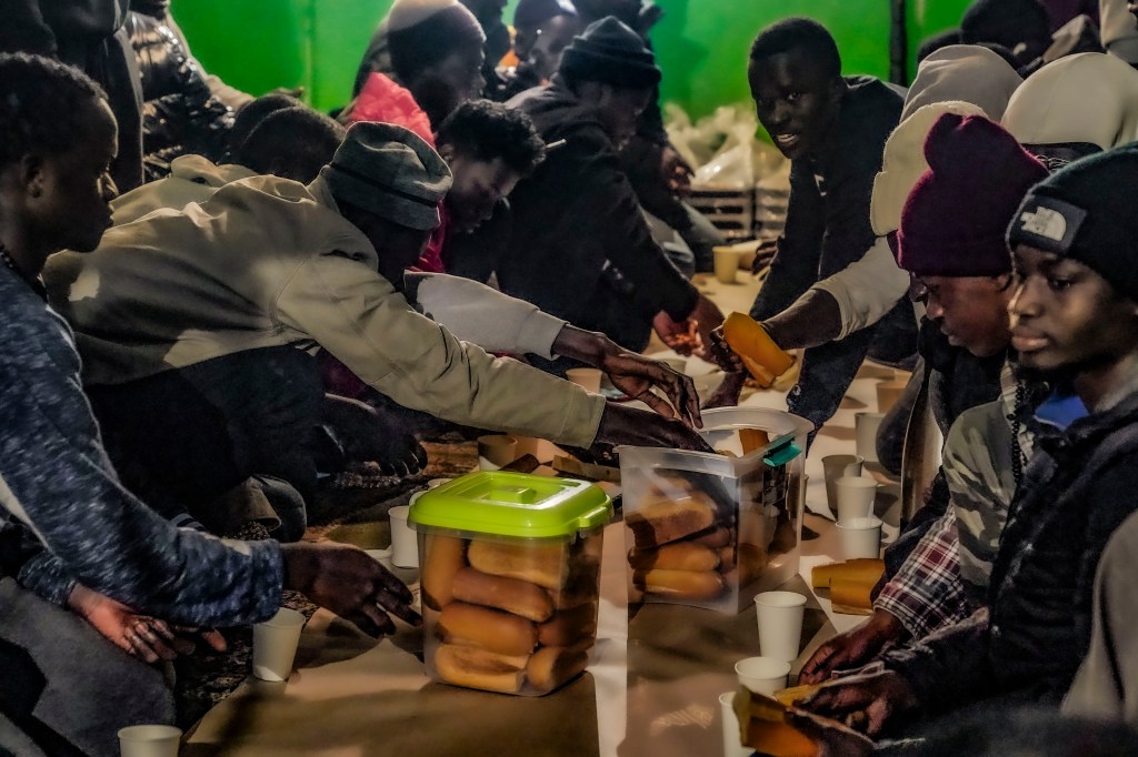 Afircan migrants breaking their Ramadan fast with a meal called iftar.