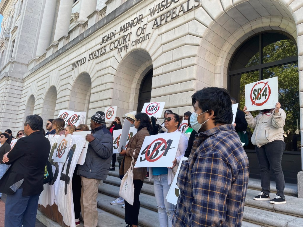 A protest against Texas' SB4 law outside federal court buildings in New Orleans on April 3, 2024.