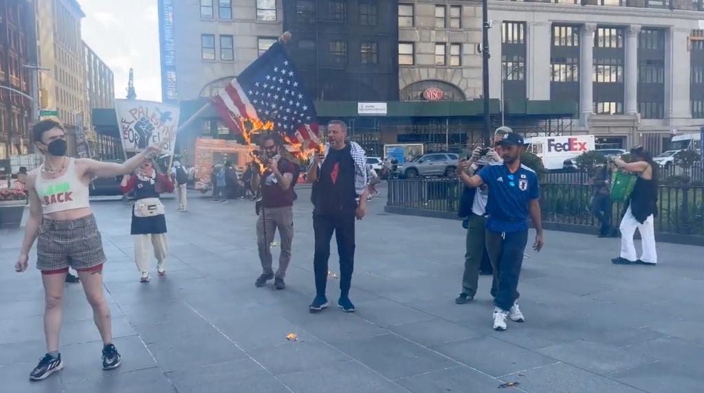 PROTESTERS BURN FLAG