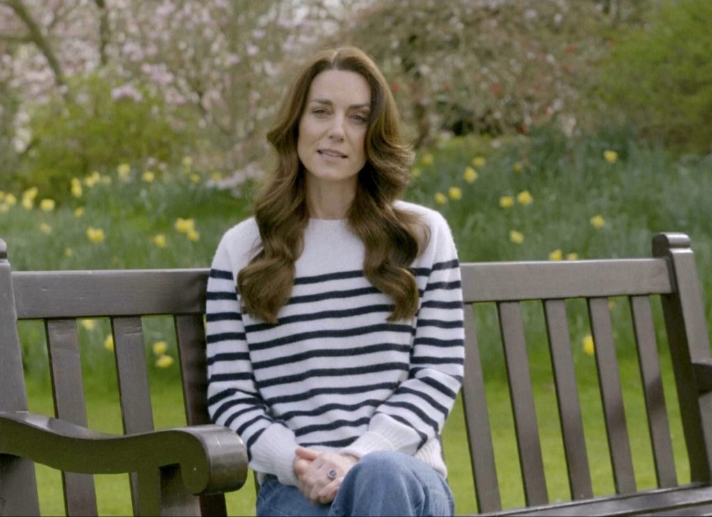 Princess Kate of Wales sitting on a bench, delivering a message about her cancer diagnosis and chemotherapy treatment