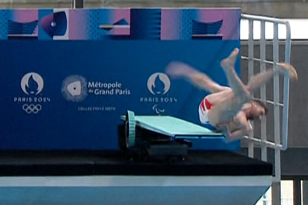 The 26-year-old Olympian landed on his back and bounced off the dive board in front of a huge crowd of spectators