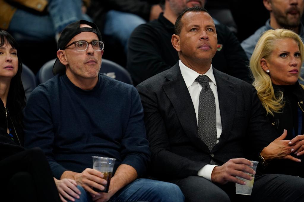 Timberwolves owners Marc Lore, left, and Alex Rodriguez watch during the first half of an NBA basketball game between the Minnesota Timberwolves and Phoenix Suns