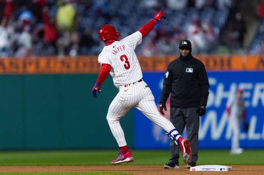 Philadelphia Phillies first baseman Bryce Harper (3) runs the bases after hitting his second home run of the game during the fourth inning against the Cincinnati Reds at Citizens Bank Park. 