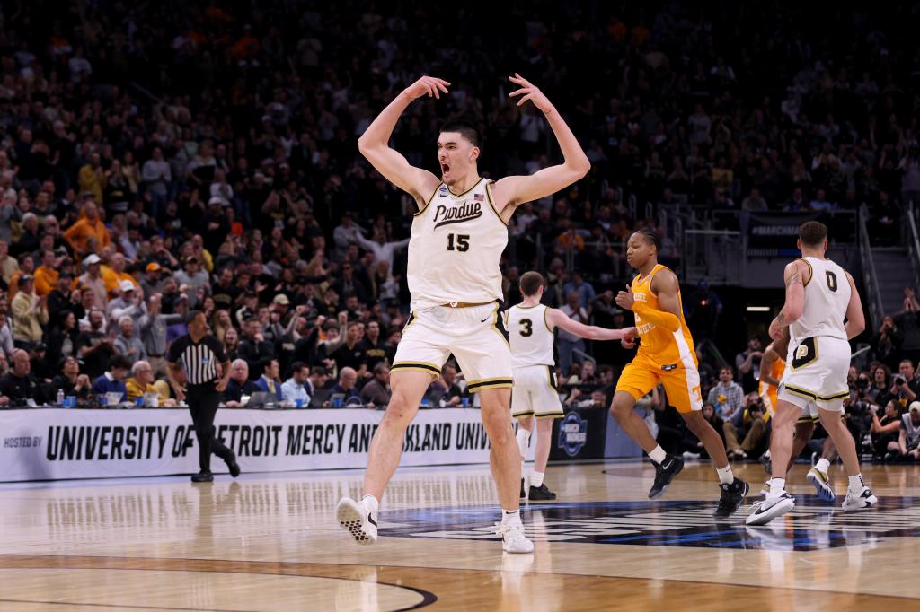 Zach Edey #15 of the Purdue Boilermakers celebrates against the Tennessee Volunteers during the second half in the Elite 8 round of the NCAA Men's Basketball Tournament at Little Caesars Arena on March 31, 2024 in Detroit, Michigan.