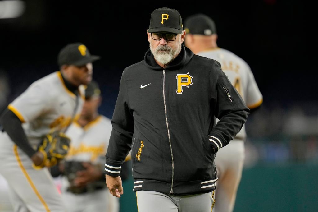 Manager Derek Shelton of the Pittsburgh Pirates walks back to the dugout after making a pitching change in the eighth inning against the Washington Nationals at Nationals Park on April 04, 2024 in Washington, DC.