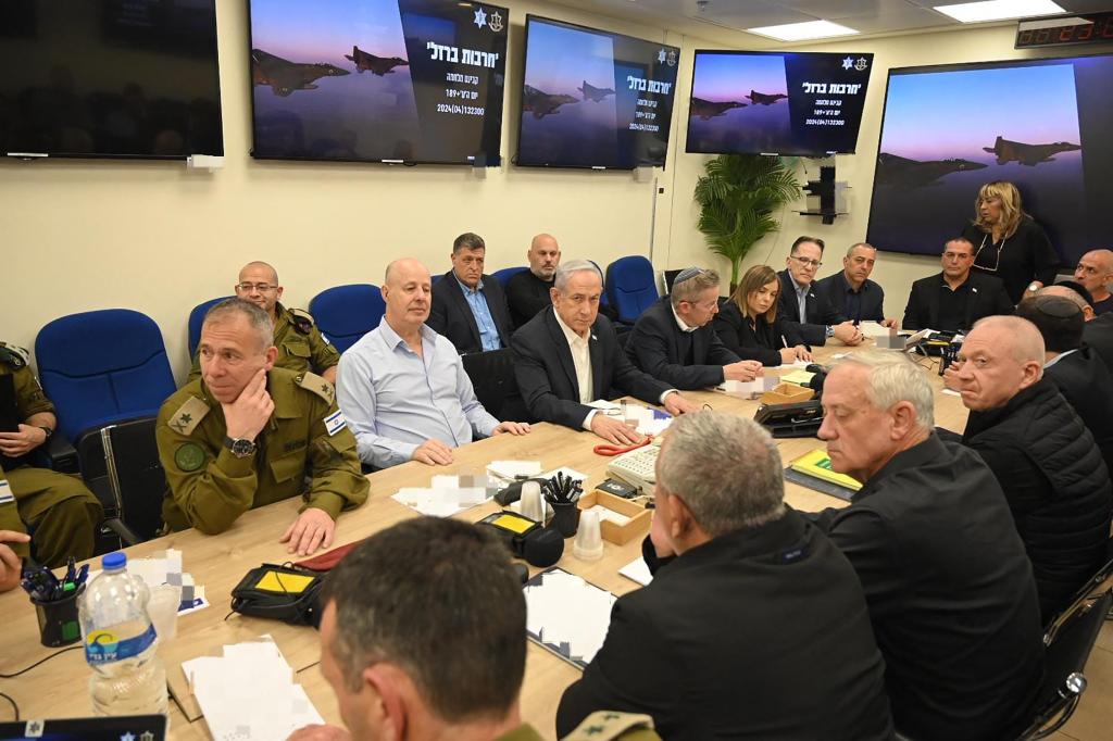 This handout picture courtesy of the Israeli Prime Minister's Office taken on April 14, 2024 shows Israel's Primr Minister Benjamin Netanyahu (C) during a War Cabinet meeting at the Kirya in Tel Aviv. 