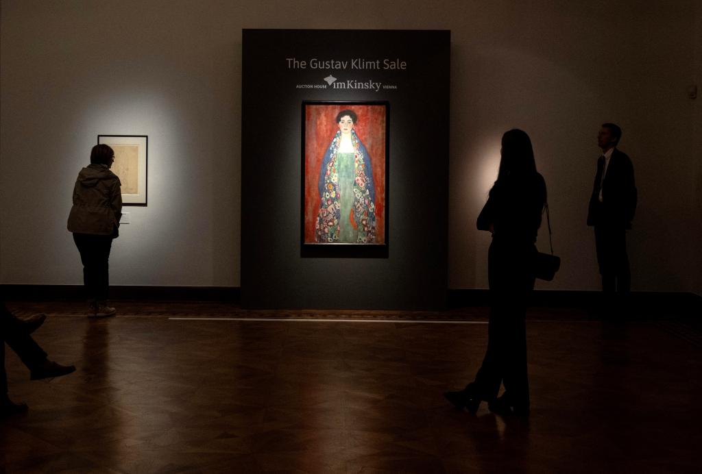 (FILES) Visitors are viewing the rediscovered painting of a young female ''Portrait of Miss Lieser'' by the Austrian painter Gustav Klimt on a display at the im Kinsky auction house in Vienna, Austria on April 16, 2024.