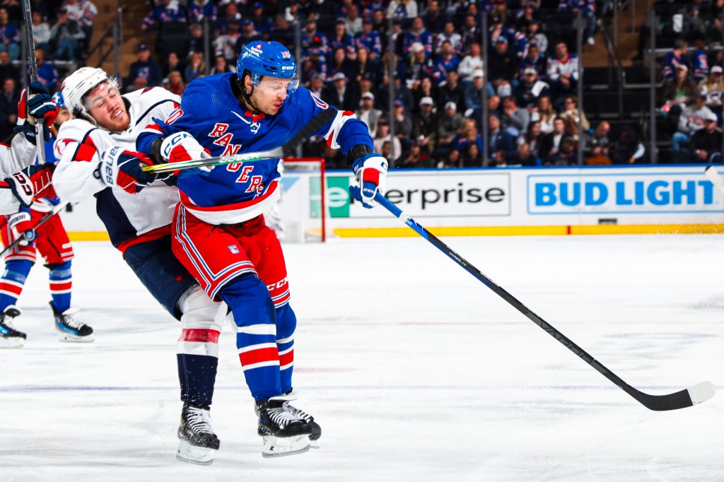 Artemi Panarin #10 of the New York Rangers collides with T.J. Oshie #77 of the Washington Capitals during the third period in Game Two of the First Round of the 2024 Stanley Cup Playoffs at Madison Square Garden on April 23, 2024 in New York City.