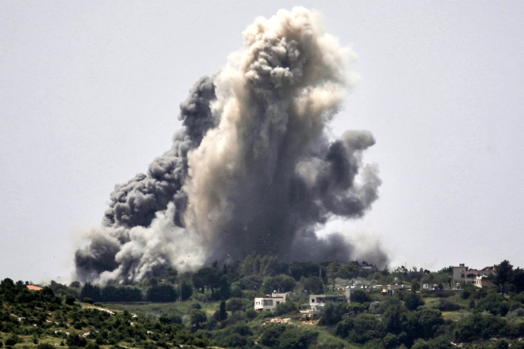 Smoke plumes erupt during Israeli bombardment on the village of Alma al-Shaab in south Lebanon on April 25, 2024 amid ongoing cross-border tensions as fighting continues between Israel and Palestinian Hamas militants in the Gaza Strip. 