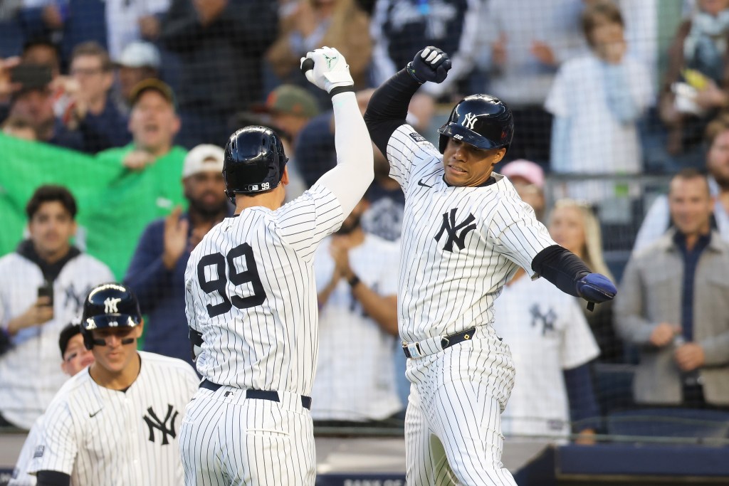 Aaron Judge #99 of the New York Yankees celebrates with Juan Soto #22 after hitting a first inning two-run home run against the Oakland Athletics  at Yankee Stadium on April 24, 2024