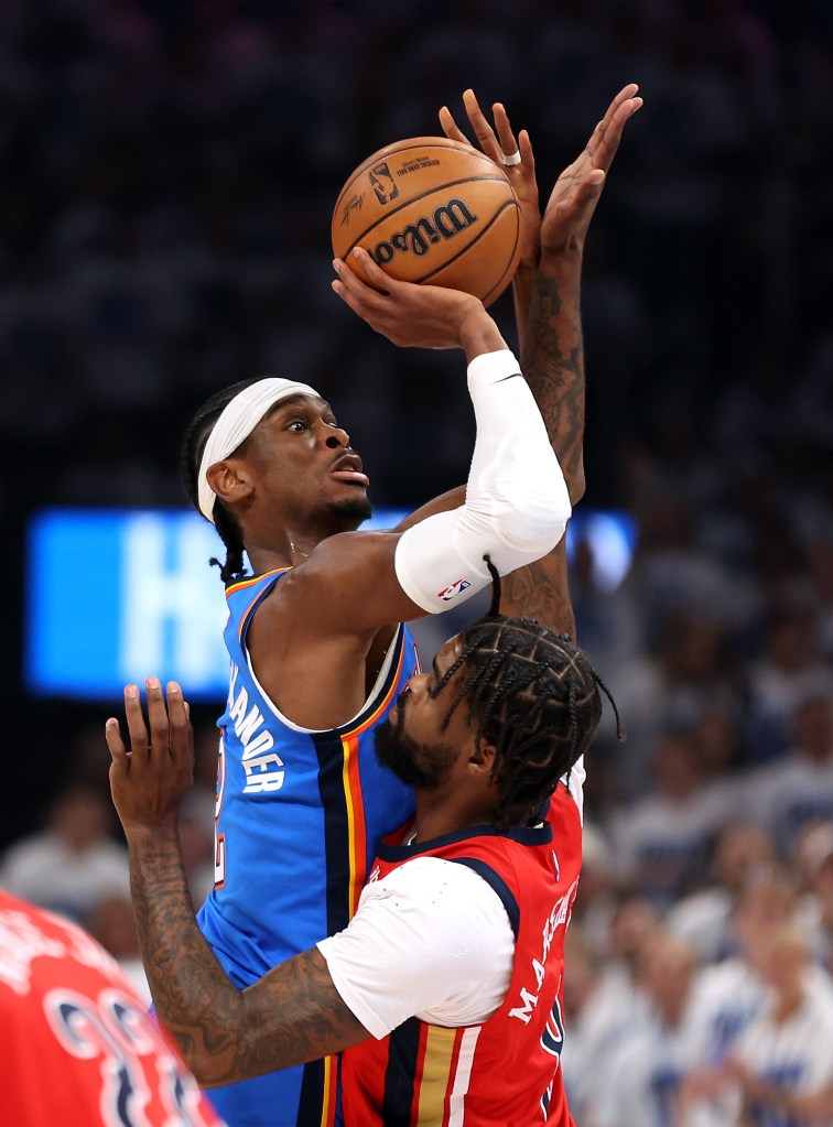 Shai Gilgeous-Alexander #2 of the Oklahoma City Thunder shoots over Naji Marshall #8 of the New Orleans Pelicans during game two of the first round of the NBA playoffs at Paycom Center on April 24, 2024 in Oklahoma City, Oklahoma.