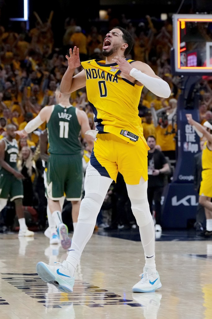 Tyrese Haliburton #0 of the Indiana Pacers celebrates after beating the Milwaukee Bucks 121-119 in overtime during game three of the Eastern Conference First Round Playoffs at Gainbridge Fieldhouse on April 26, 2024 in Indianapolis, Indiana.