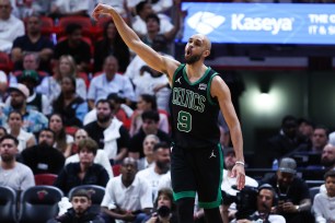 Derrick White of the Celtics reacts after making a basket on his way to 38 points Monday night in Game 4 against the Heat.