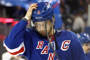 Jacob Trouba of the Rangers adjusts his helmet prior to the game against the Penguins at Madison Square Garden on Monday.