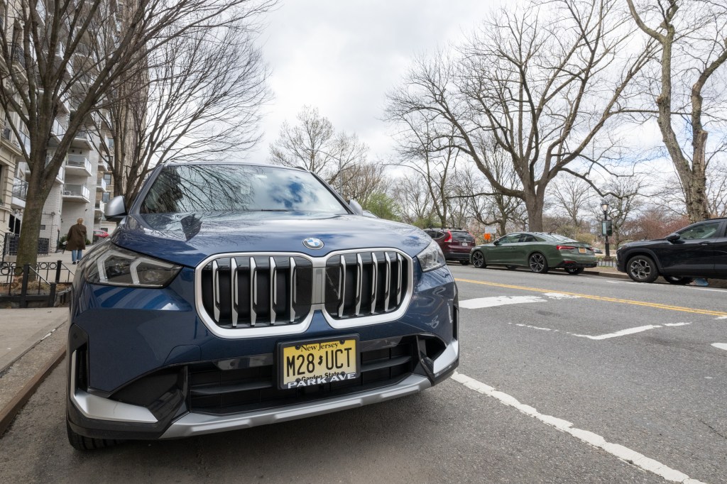 A blue SUV with New Jersey plates parked on Riverside Drive.