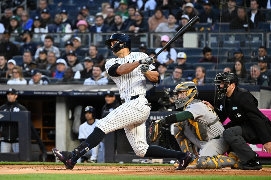 Giancarlo Stanton delivers a two-RBI double on Tuesday.