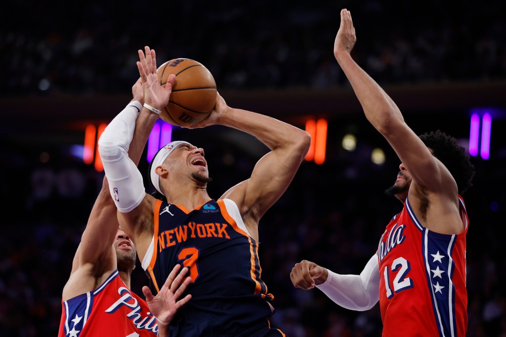 Josh Hart #3 of the New York Knicks shoots the ball as Nicolas Batum #40 of the Philadelphia 76ers and Tobias Harris #12 defend during the second half in Game Two of the Eastern Conference First Round Playoffs at Madison Square Garden.