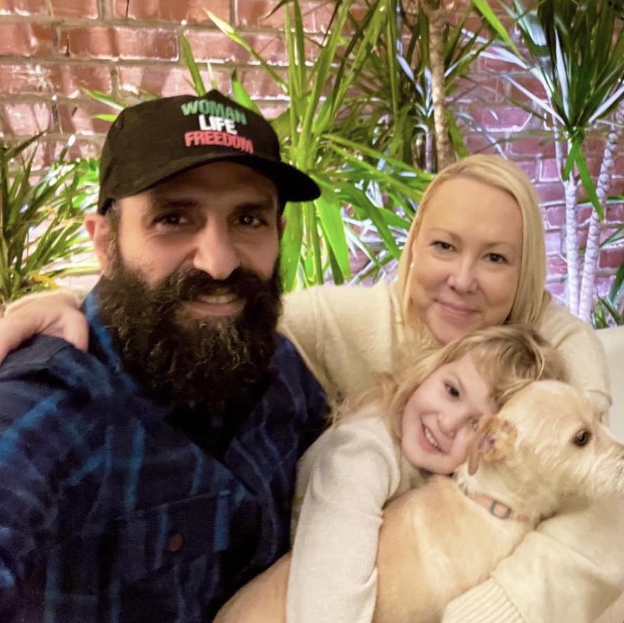 Mehrad, Elizabeth, their daughter, and Mishka. 