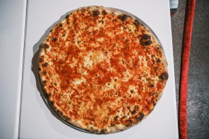 A food historian claimed that the US created "pizza rossa:" the red tomato sauce that adorns pizza.