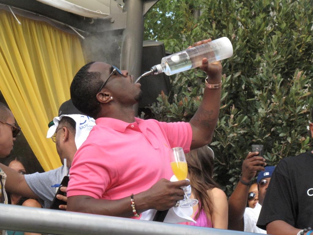 Sean 'Diddy' Combs performing and hosting at Palms Pool, Las Vegas, with Akon and Christina Milian present, pouring Ciroc into a glass