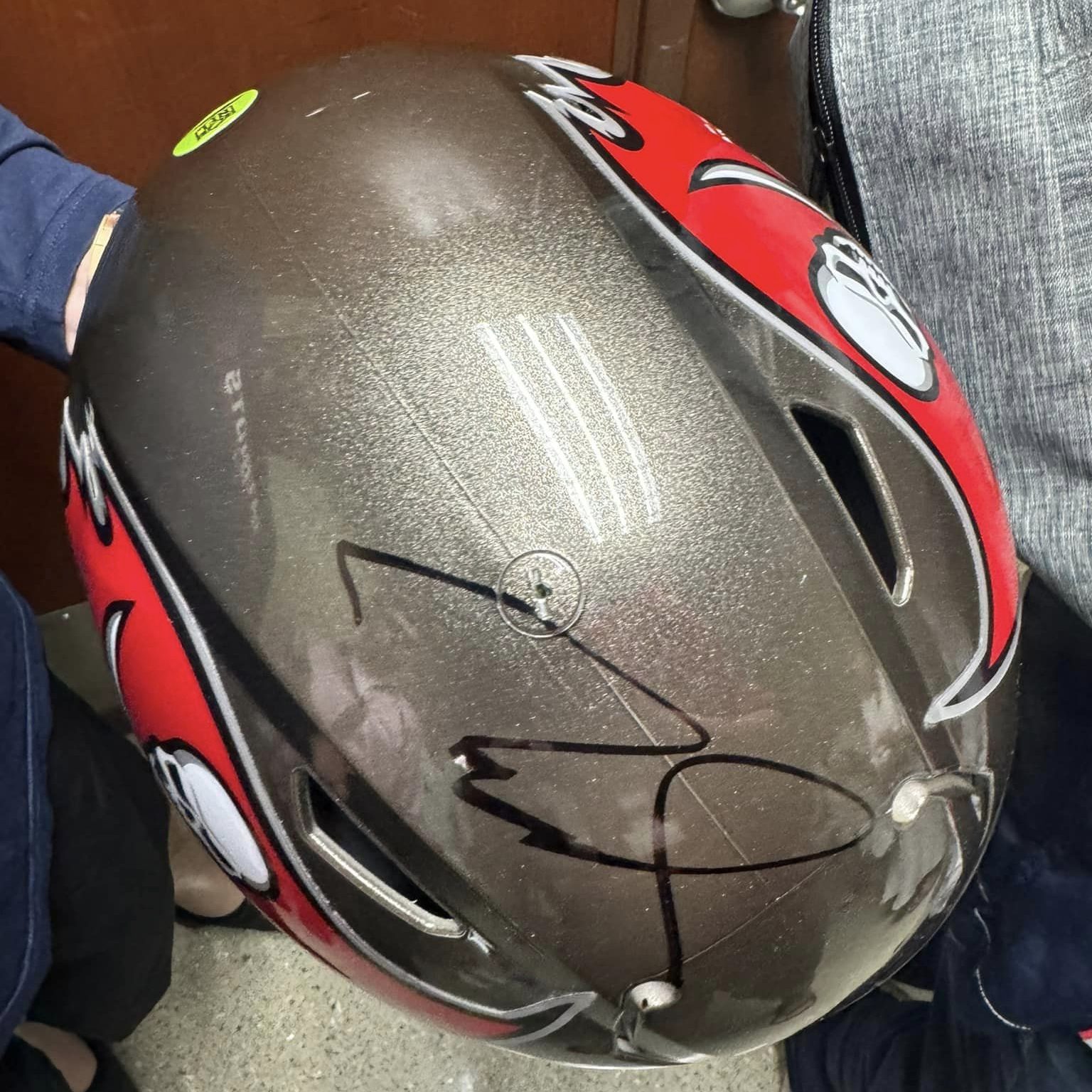 A Tom Brady-worn helmet, which the owner complained was sloppily signed by the former QB
