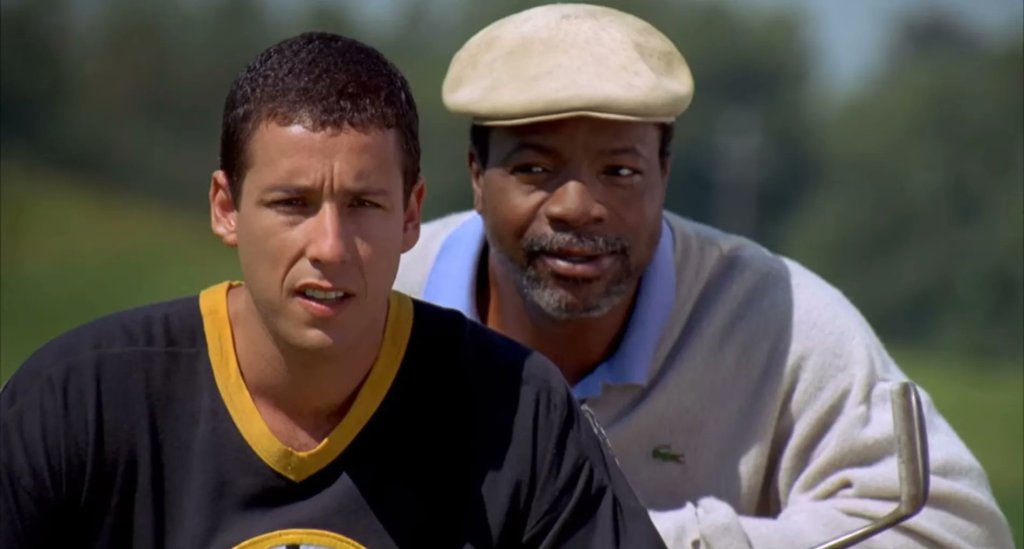 Adam Sandler as Happy Gilmore and Carl Weathers as Happy's coach, "Chubbs" Peterson, in "Happy Gilmore."