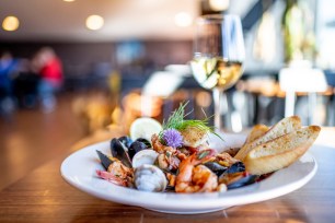 Plate of shrimp and mussels, with bread.