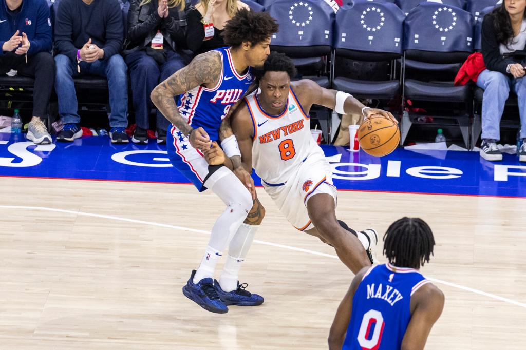 OG Anunoby #8 of the New York Knicks drives down curt as Kelly Oubre Jr. #9 of the Philadelphia 76ers defends during the second half of game 3