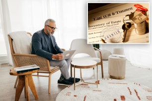 A man sitting in a chair using a laptop