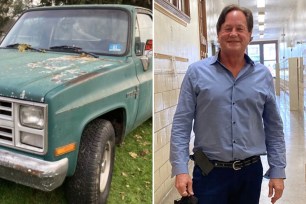 A man standing next to a green truck