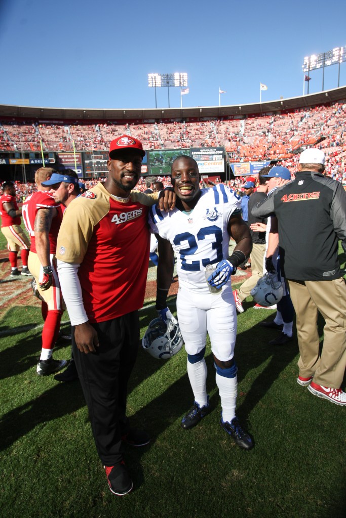 Vernon Davis #85 of the San Francisco 49ers stands with his brother Vontae Davis #23 of the Indianapolis Colts following the game at Candlestick Park on September 22, 2013