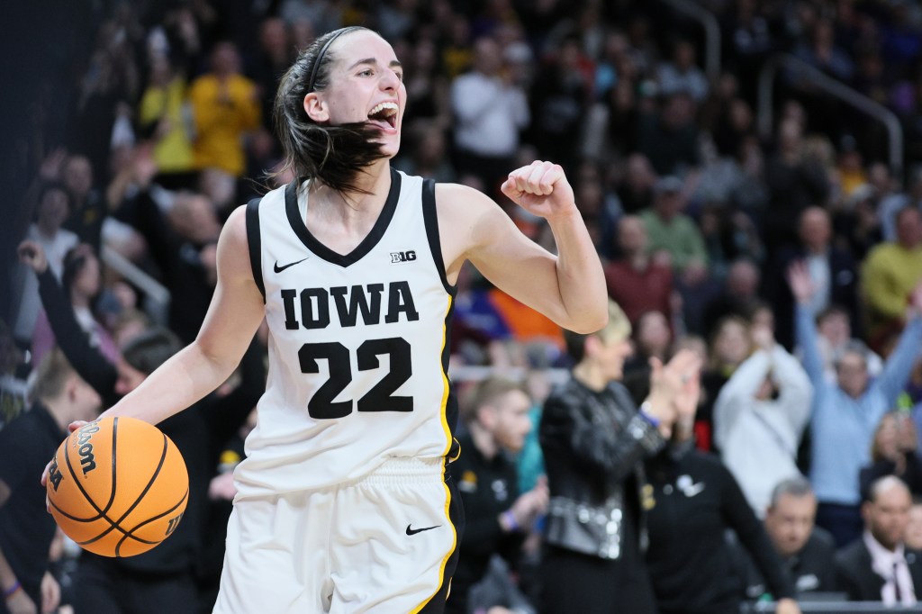 Caitlin Clark celebrates Iowa's March Madness win over LSU on Monday.