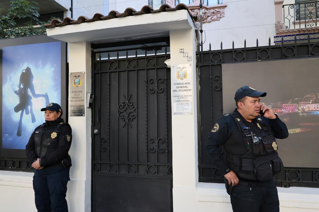 Mexican police officers standing guard outside the Ecuadorian Embassy in Mexico City, April 6, 2024