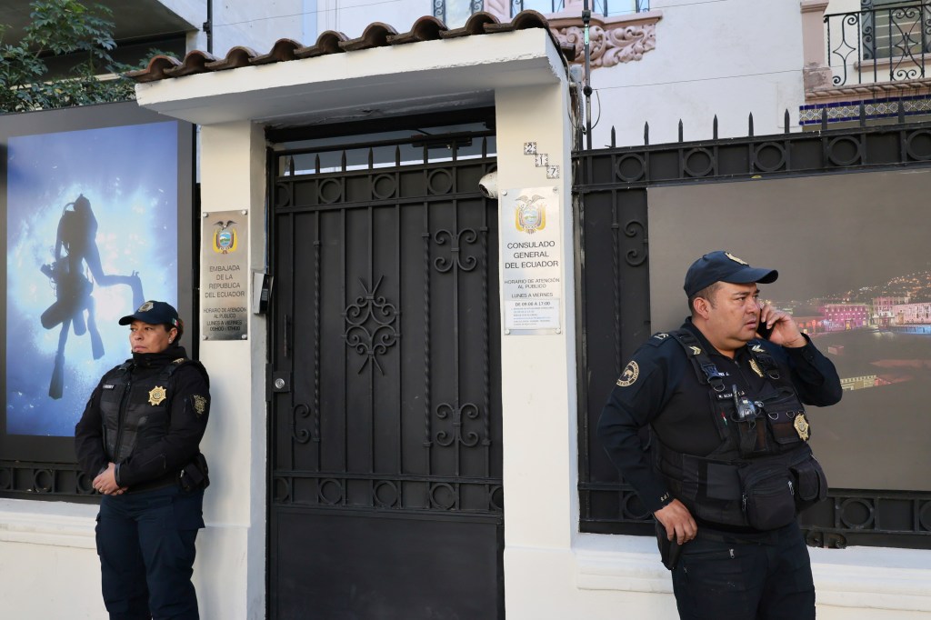 Mexican police officers standing guard outside the Ecuadorian Embassy in Mexico City, April 6, 2024