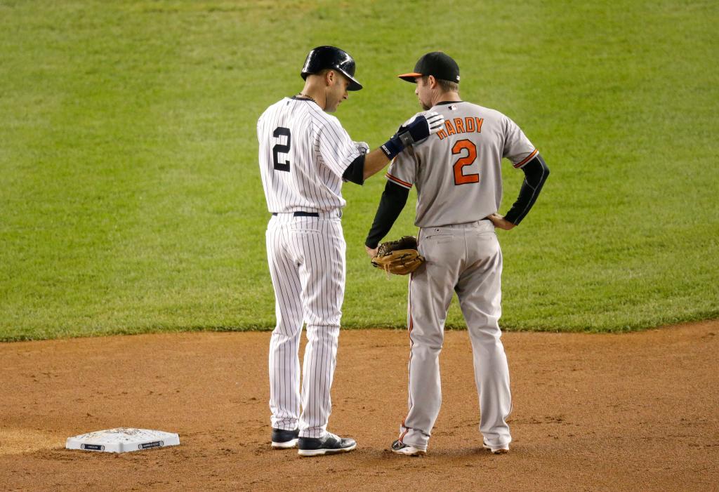 New York Yankees shortstop Derek Jeter talks with Baltimore Orioles shortstop JJ Hardy at second base during the first inning of a game at Yankee Stadium on Sept. 25, 2014.
