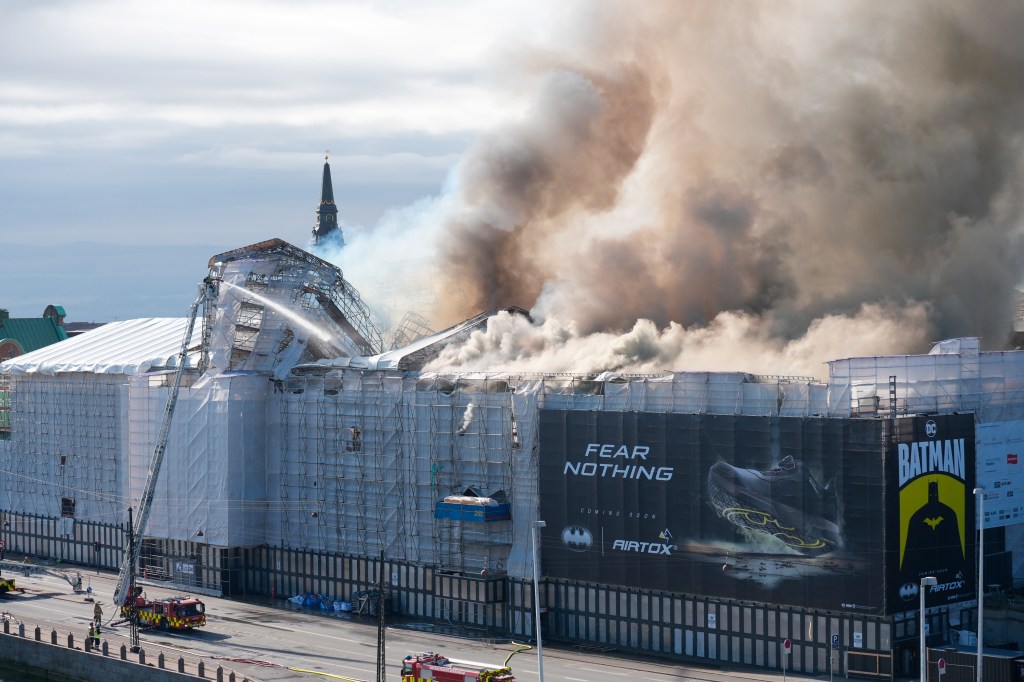 Smoke rise out of the Old Stock Exchange, Boersen, in Copenhagen, Denmark, is shown on April 16, 2024. 