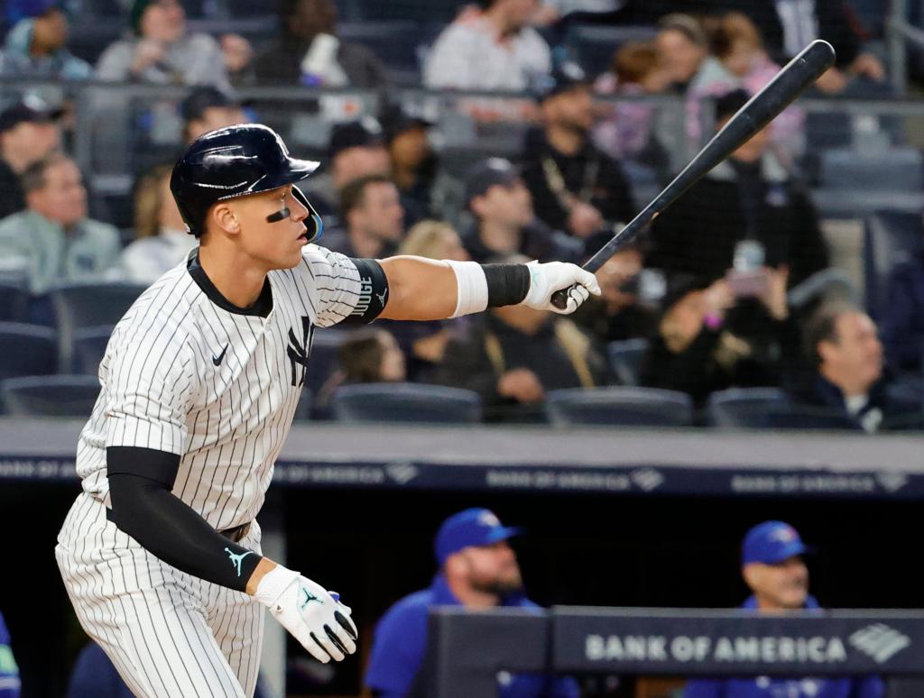 Aaron Judge belts a two-run homer in the first inning of the Yankees' 9-8 win over the Blue Jays.
