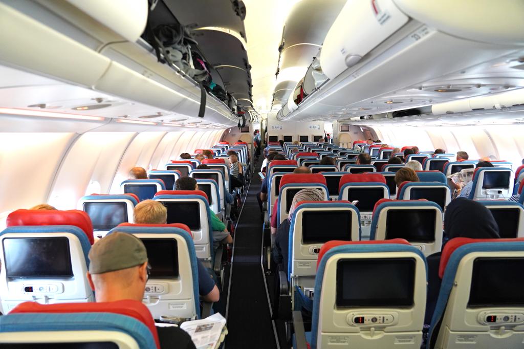 Flying in the middle seat can be brutal. Some experts say the only reward is having access to both armrests. Others disagree.