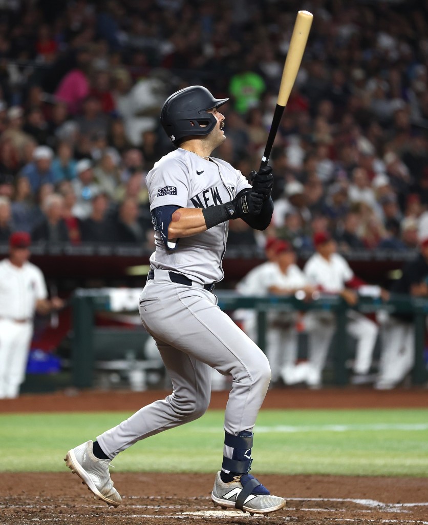 Austin Wells hits a sacrifice fly in the third inning of the Yankees' win on Monday.