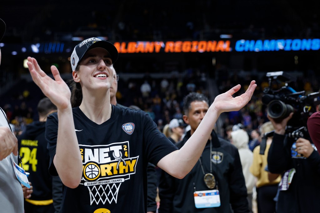 Caitlin Clark #22 of the Iowa Hawkeyes celebrates after beating the LSU Tigers 94-87 in the Elite 8 round of the NCAA Women's Basketball Tournament.