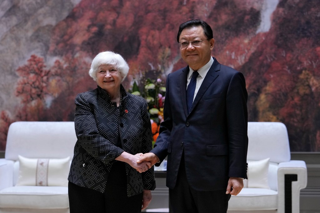 Yellen, left, shakes hands with Wang Weizhong, deputy party secretary and governor of Guangdong prior to a meeting at the Baiyun International Conference Center (BICC) in southern China's Guangdong province, Friday, April 5, 2024. 